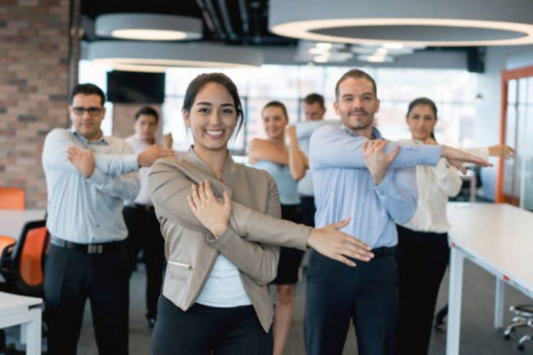 Group of office workers exercising