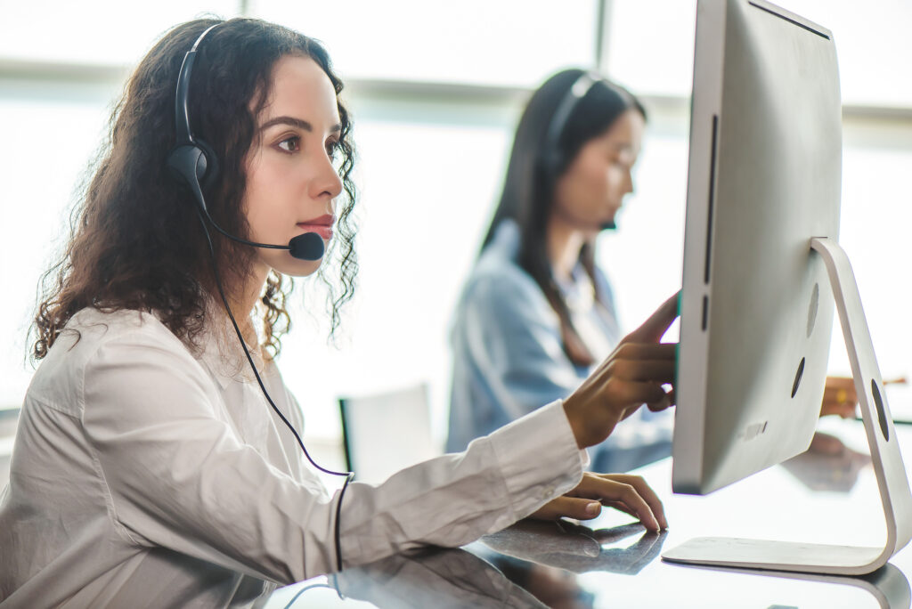 Nonclinical operators in a call center use MedMessage Assist on their computers to lower malpractice liability.