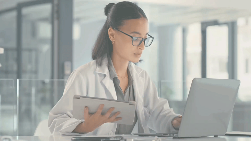 A nurse reviews a patient request sent from her practice's medical answering services.