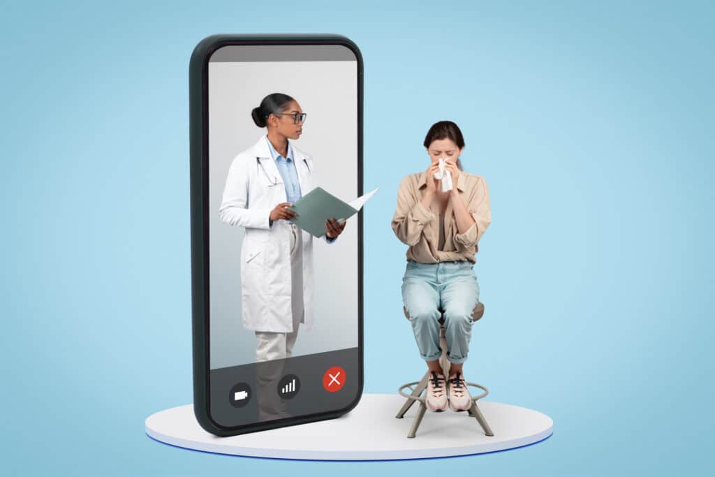 A telehealth nurse provides patient care over a smartphone by evaluating a patient caller's symptoms.
