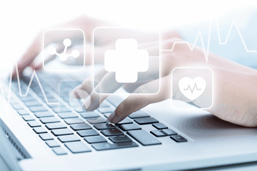 A nurse uses triage software while healthcare icons hover above a laptop keyboard.