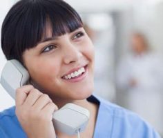 Triage nurse speaking on the phone with a patient