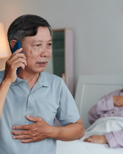 A worried elderly man calls a triage line to talk about his ailing wife's symptoms.